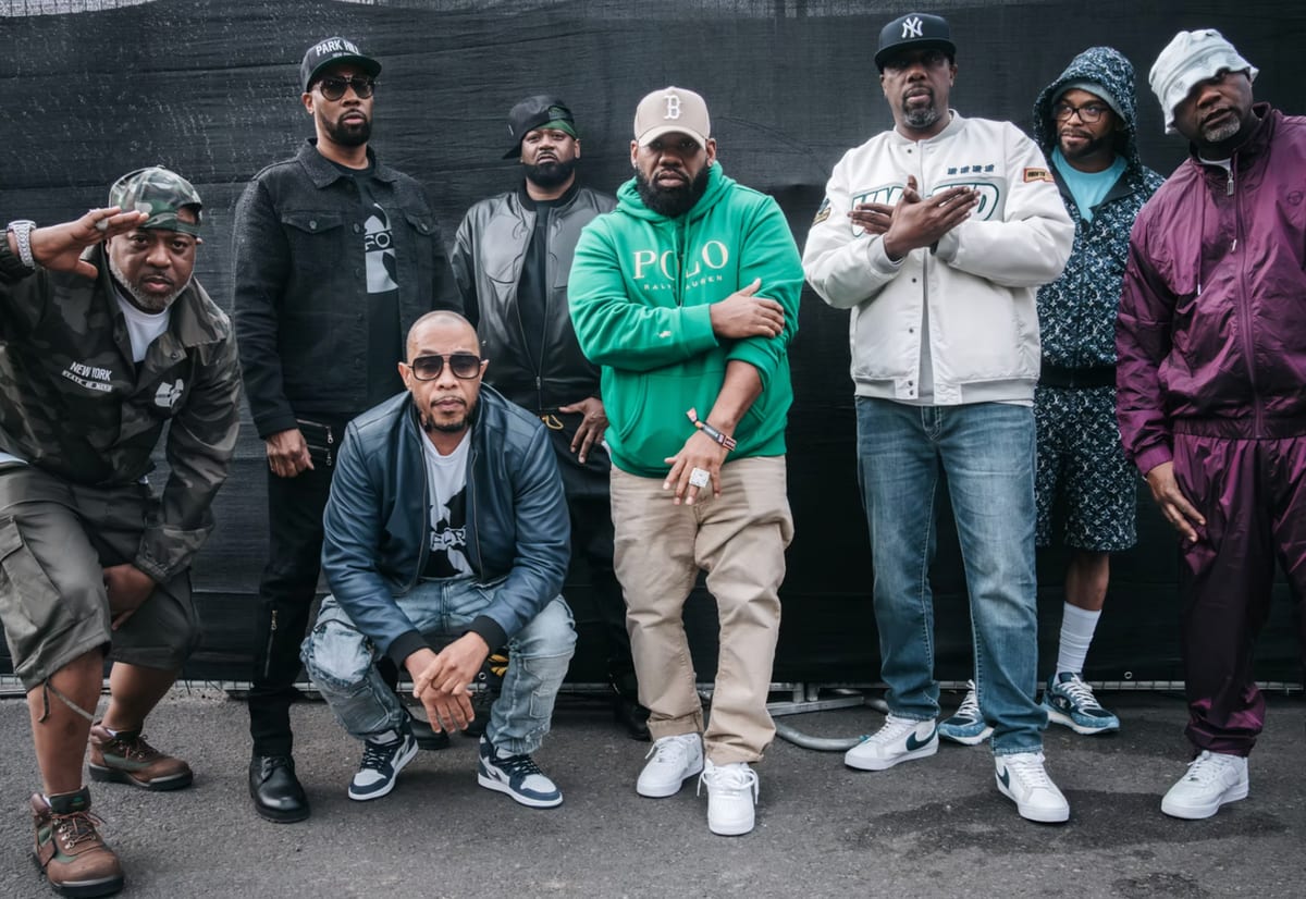 Seven members of Wu-Tang Clan posed against a dark backdrop at BottleRock Napa Valley